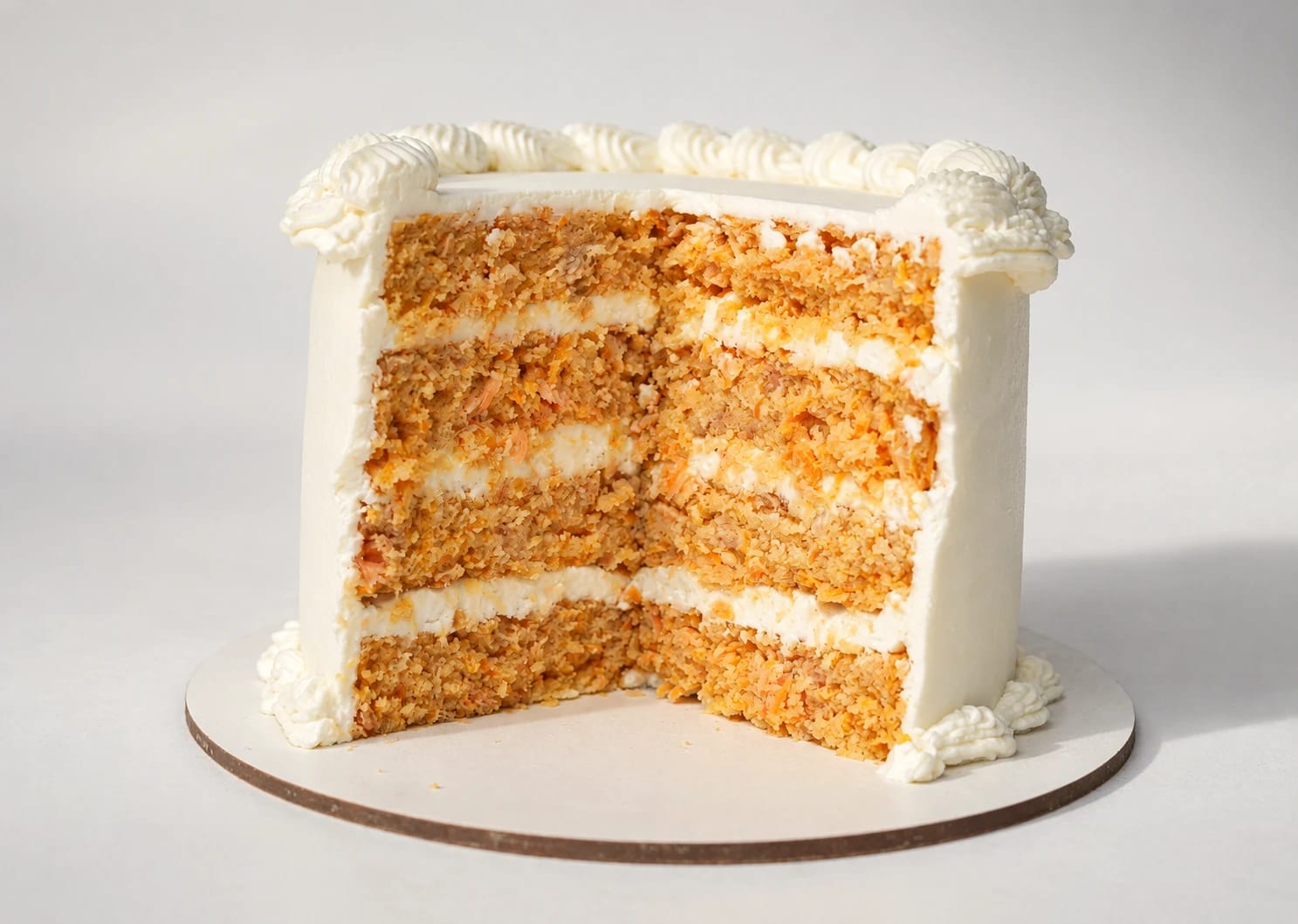 A cut cake showing its layers and filling