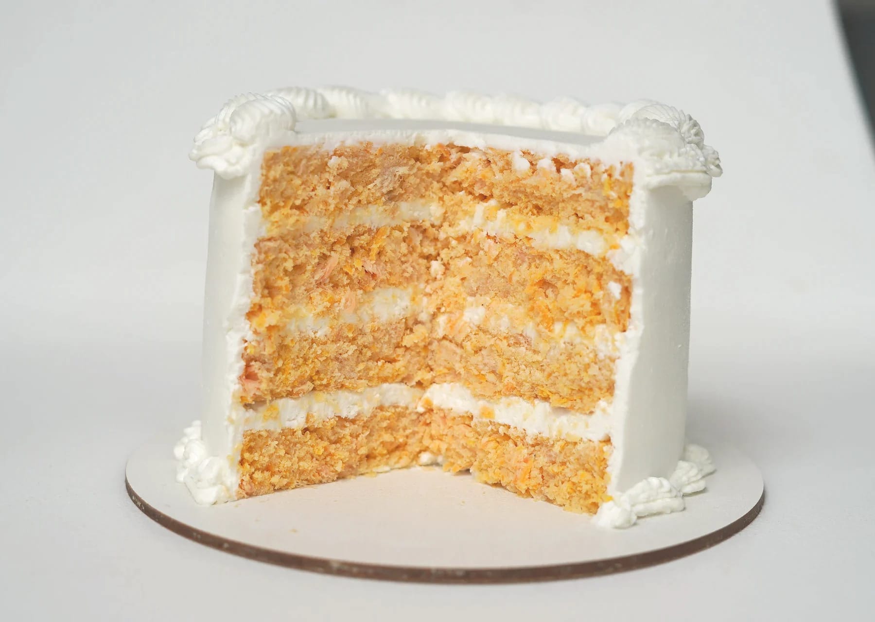 Cut HAV HAV dog cake showing its baked layers, filling and smooth outer covering